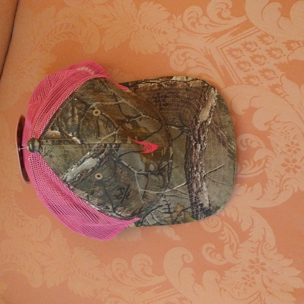 NWT. Women's camouflage and pink baseball cap.